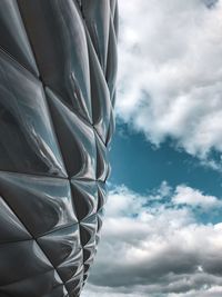 Low angle view of building against cloudy sky