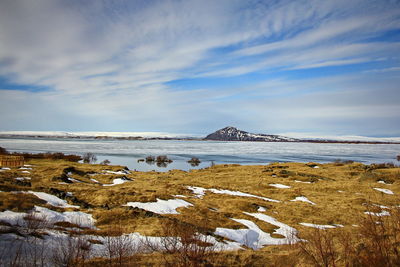 Scenic view of sea against sky during winter