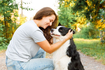 Portrait of young woman with dog