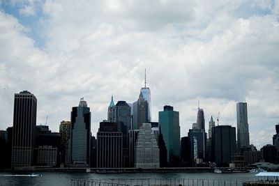 City skyline against cloudy sky