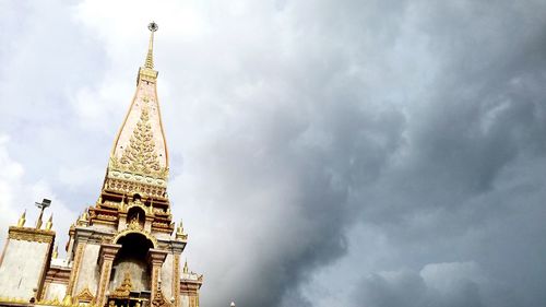 Low angle view of church against cloudy sky