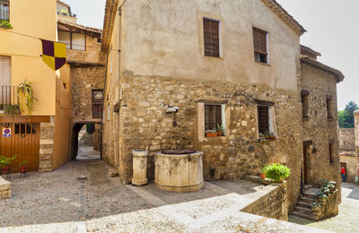 Footpath amidst buildings in town