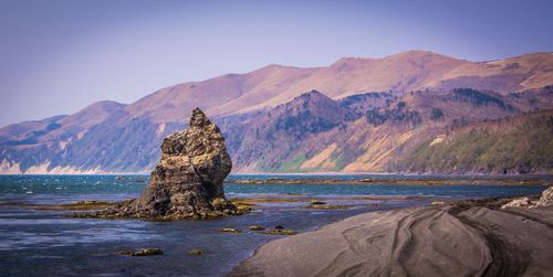 Scenic view of beach against clear sky