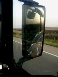 Reflection of car on side-view mirror