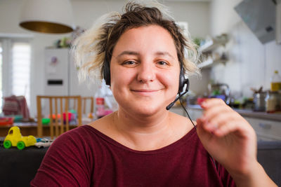 Portrait of smiling woman at home