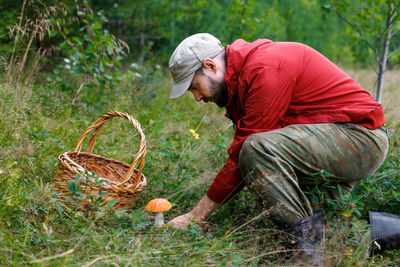 Rear view of farmer working in farm