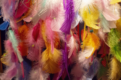 Close-up of multi colored decorations hanging for sale