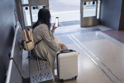 Woman waiting at train station