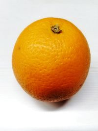 Close-up of orange on white background