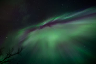 Low angle view of snow against sky at night