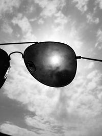 Low angle view of sunglasses against sky