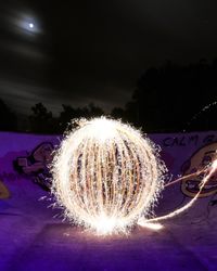 Light painting against sky at night