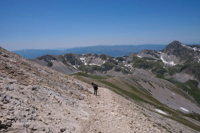 Climbers in the mountainous complex of the gran sasso d'italia abruzzo