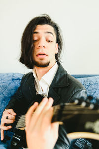 Young man playing guitar