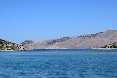 Scenic view of mountain against clear blue sky