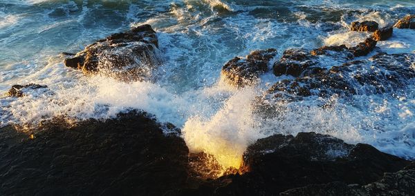 Sea waves splashing on rocks