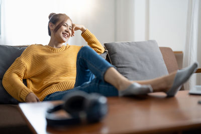 Young woman using laptop at home