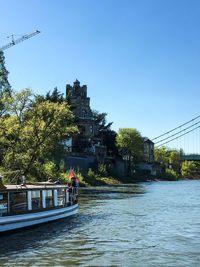 Calm river with buildings in background