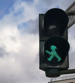 Low angle view of road sign against sky 