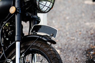 Close-up of motorcycle parked on street