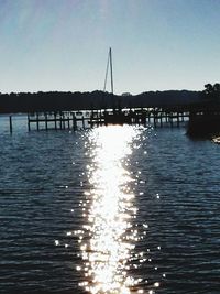 Silhouette of boat sailing in sea