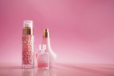 Close-up of bottles against yellow background