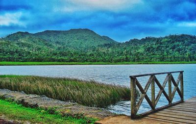 Scenic view of lake against cloudy sky