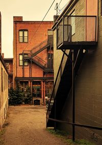 Staircase by building against sky