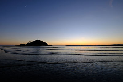 View of beach at sunset