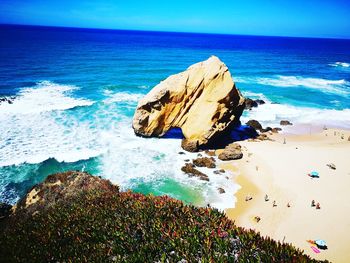 High angle view of rocks on beach against sky