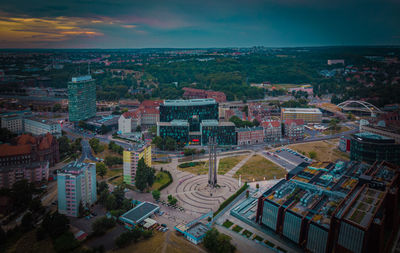 High angle view of buildings in city against sky