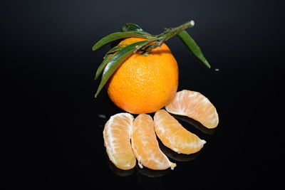 High angle view of orange fruit against black background
