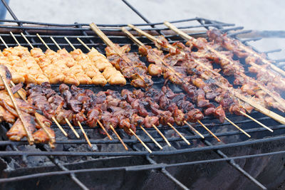 High angle view of meat on barbecue grill