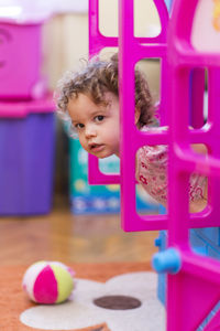 Portrait of cute girl playing with ball