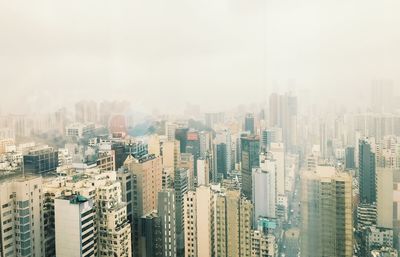 High angle view of buildings in city against sky