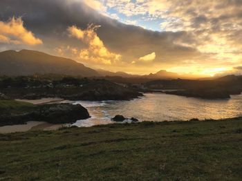 Scenic view of sea against cloudy sky