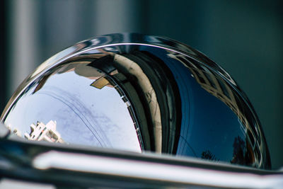 Reflection of sky on side-view mirror