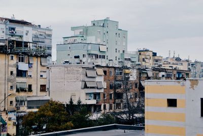 High angle view of buildings in city against sky