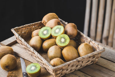 High angle view of fruits in basket on table