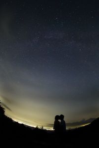 Scenic view of landscape against sky at night