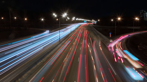 Long exposured blurred motion. trails of cars in the night. light trails of car driving on motorway