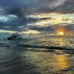 Scenic view of sea against cloudy sky