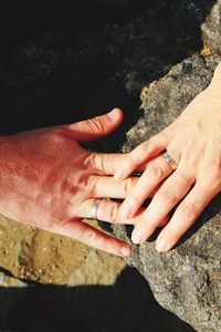 High angle view of people on rock