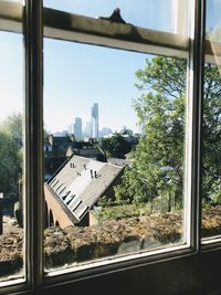 Buildings seen through glass window