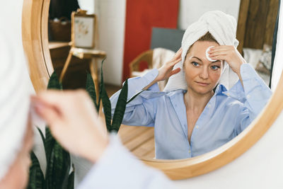 Portrait of young woman using mobile phone