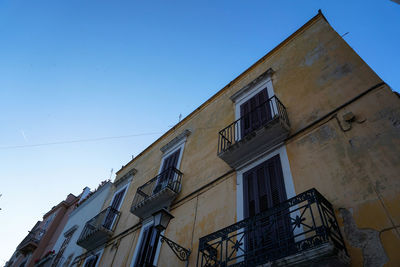 Low angle view of building against blue sky