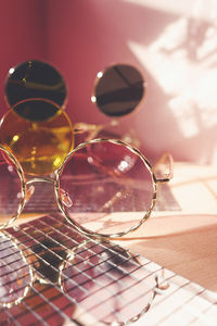 Close-up of sunglasses on table