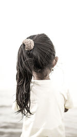 Rear view of woman with umbrella