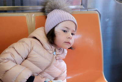 Cute young girl on the train in nyc