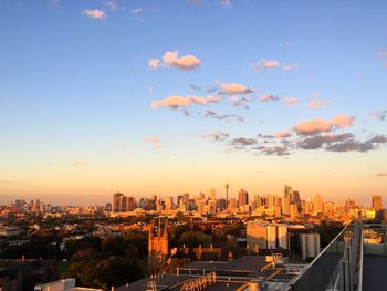High angle view of buildings against sky during sunset